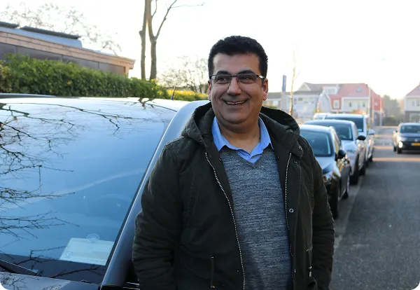 Driver posing with car on TX day